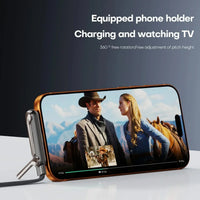 Phone holder with a phone displaying a movie scene, on a dark background