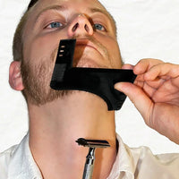 Using the template comb guide to trim a sharp symmetrical cheek line with a razor