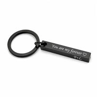 Display layout showcasing multiple metallic color choices including gold silver rose gold black and rainbow bar keychains