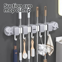 Hand peeling the protective back film to install the multi-hook rack on a smooth tile wall