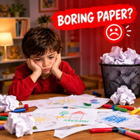 A young boy in a red shirt sits at a wooden table, looking sad and bored with crumpled paper and colored pencils around him. A red banner at the top reads 'BORING PAPER?' with a sad face icon.
