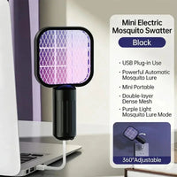 Mini electric mosquito swatter with USB plug-in feature on a laptop.