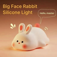 Silicone light shaped like a rabbit with a warm glow on a brown background