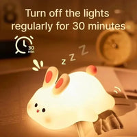 Bottom view of the rechargeable bunny night light showing the USB charging port