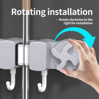Close-up highlighting mechanical action of extending dynamic hooks out from the foldable wall holder
