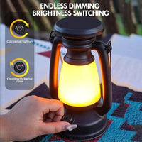 Hand holding a dimmable lantern with instructions on how to adjust brightness.