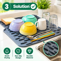 Water automatically flowing through the drainage channels of the silicone mat into the kitchen sink