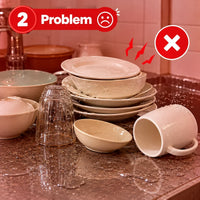 Wet dirty dishes and puddles of water on a kitchen countertop creating a mess.