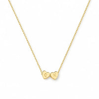 Complete premium display packaging layout of the personalized tiny heart initial gold necklace inside its elegant jewelry box