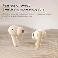 A pair of wireless earbuds in a warm cream color, displayed against a stylized beige background with text that reads 'Fearless of sweat Exercise is more enjoyable'.