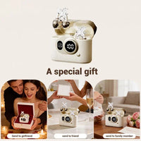 A collage-style promotional image showing a small cream-colored jewelry box with a digital display and decorative bow, plus three lifestyle photos of people receiving the gift. Text reads 'A special gift' and 'Send to giftpoint, send to friend, send to family member.