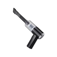 Wireless mini handheld vacuum cleaner cleaning dust crumbs from a car seat corner gap